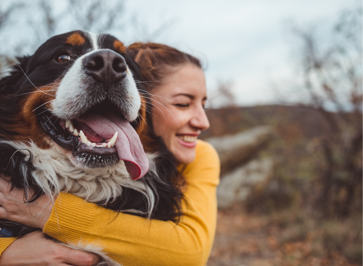 Woman hugging a large dog