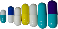 a row of differently colored medication capsules stacked from smallest to largest