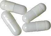 Four white capsules, in a slightly staggered arrangement