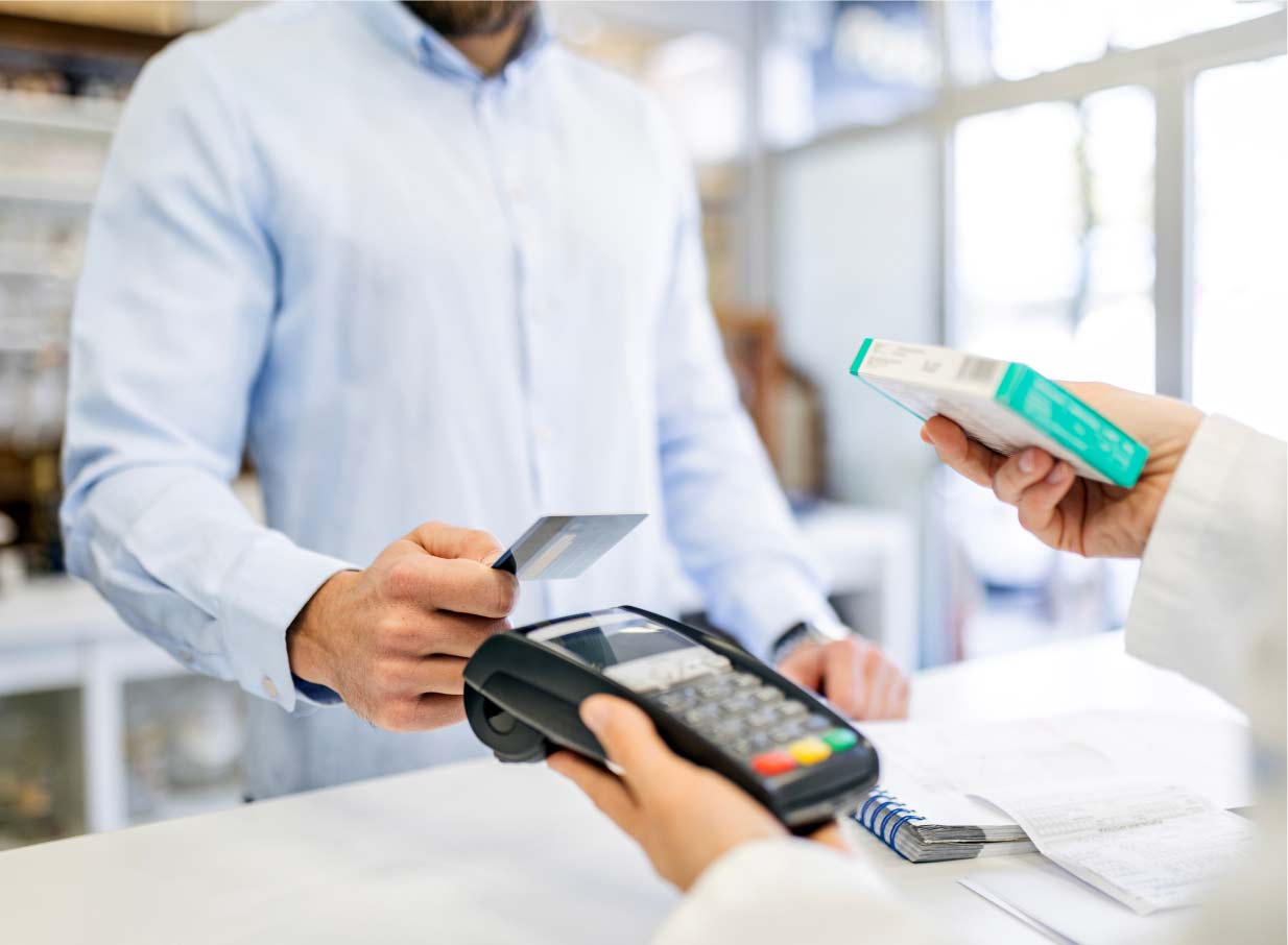 Man offering his payment card to a handheld point-of-sale device