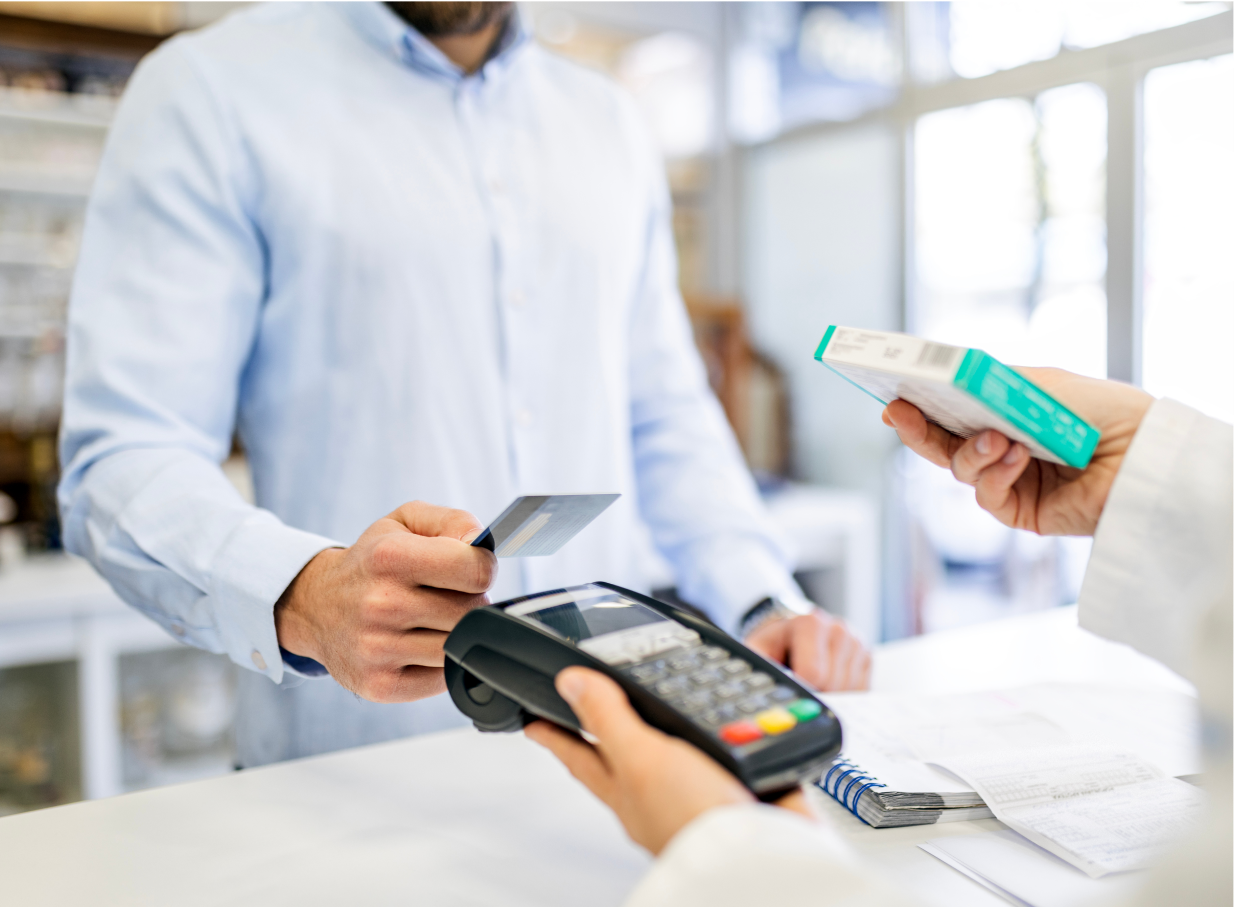 Man offering his payment card to a handheld point-of-sale device