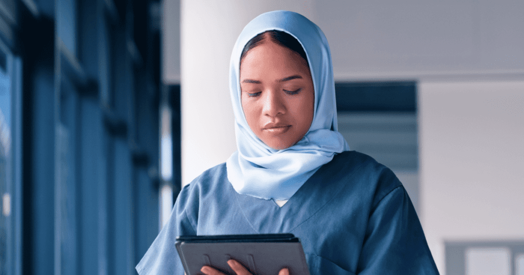 A female tech using a tablet with calm focus