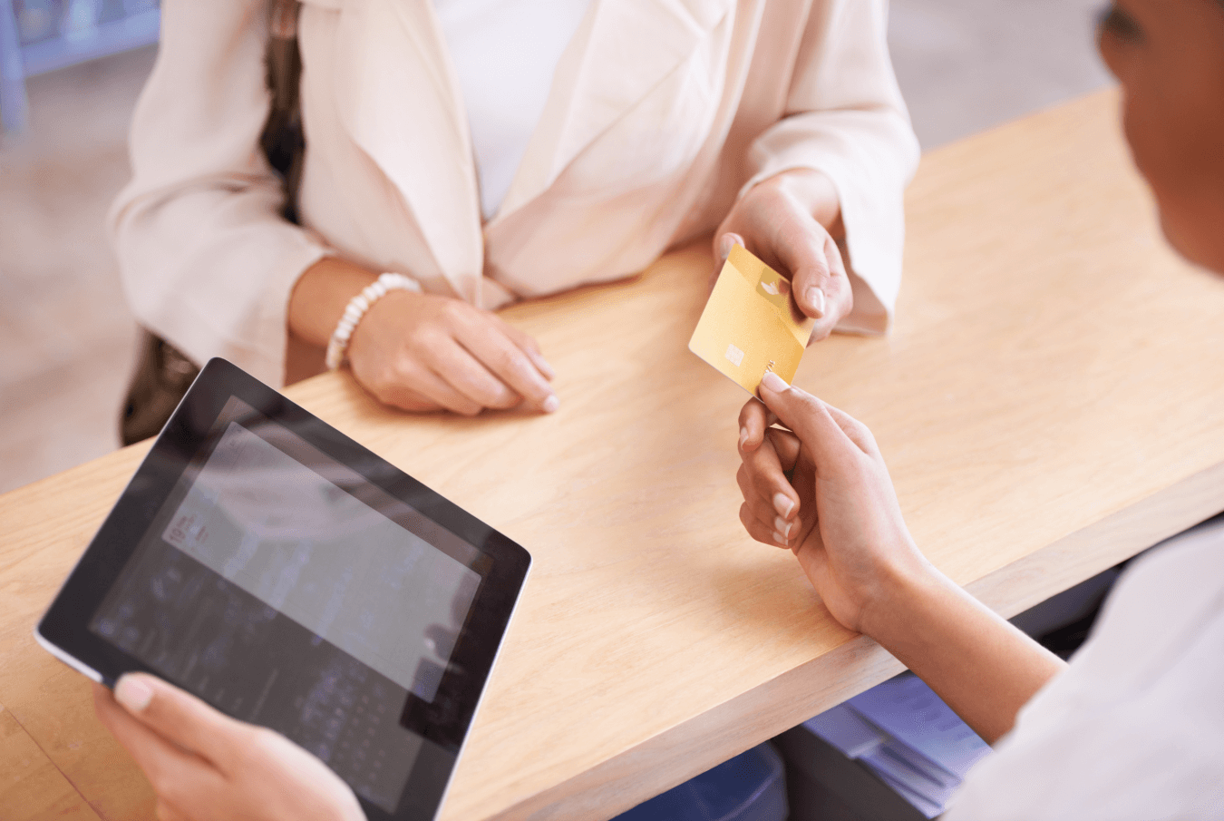 Pet parent making a credit card payment at the point of sale.